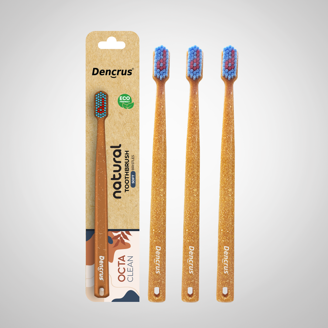 3 Bamboo toothbrushes with blue and red bristles, packaged in a cardboard casing with 'dencrus' and 'natural octa clean' branding.