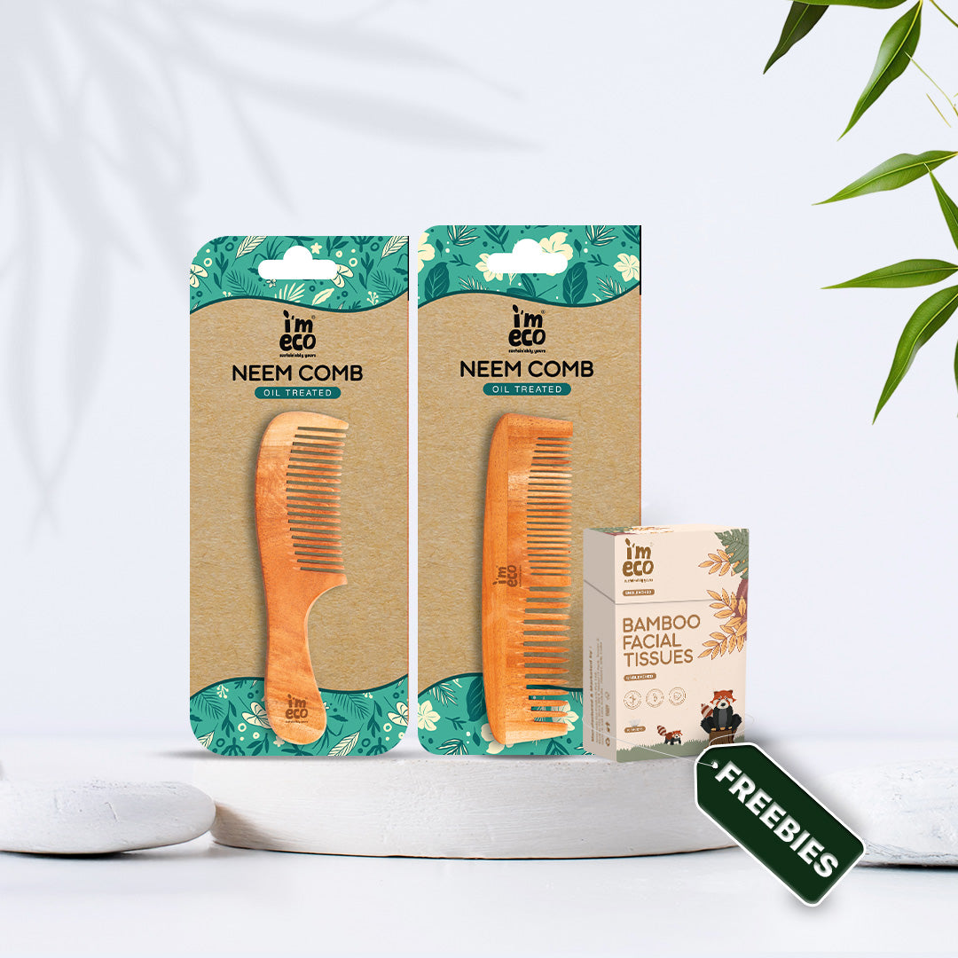 Two eco-friendly neem combs with packaging and pocket tissues on a white background.