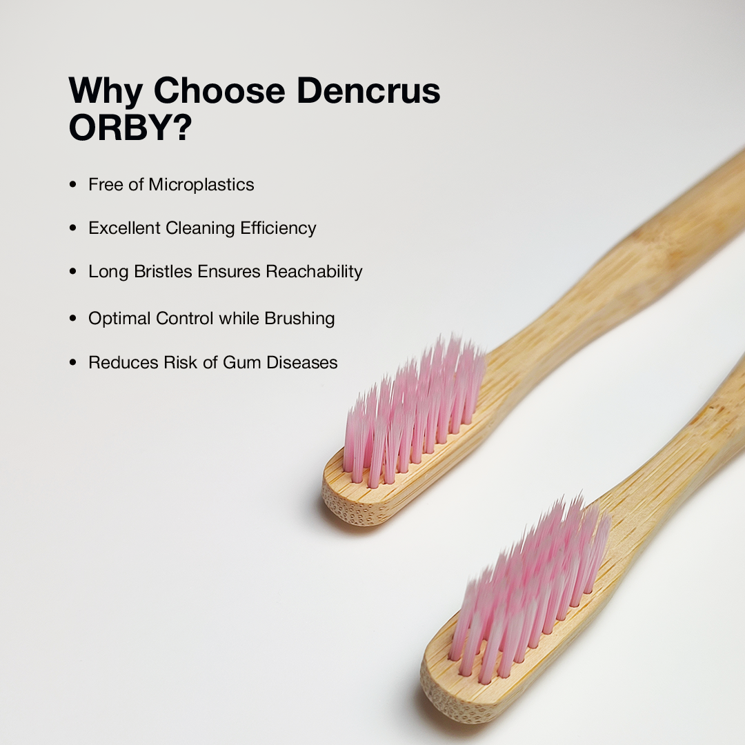 Two Dencrus ORBY Plus pink bamboo toothbrushes against a white background highlighting all the key features