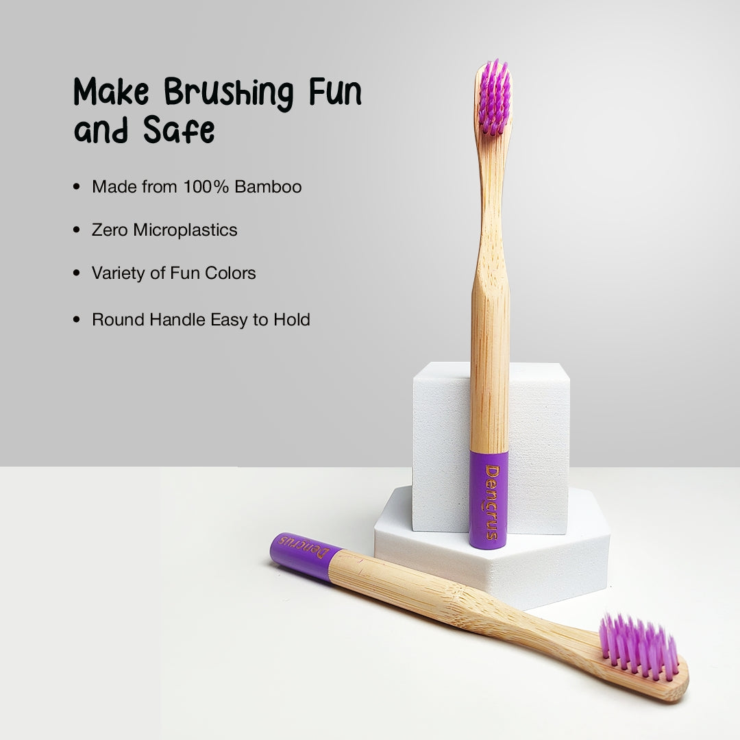 Two ORBY Kids Bamboo Tooth brush, one is standing and other one is placed on a two white blocks against a white background highlighting the key features