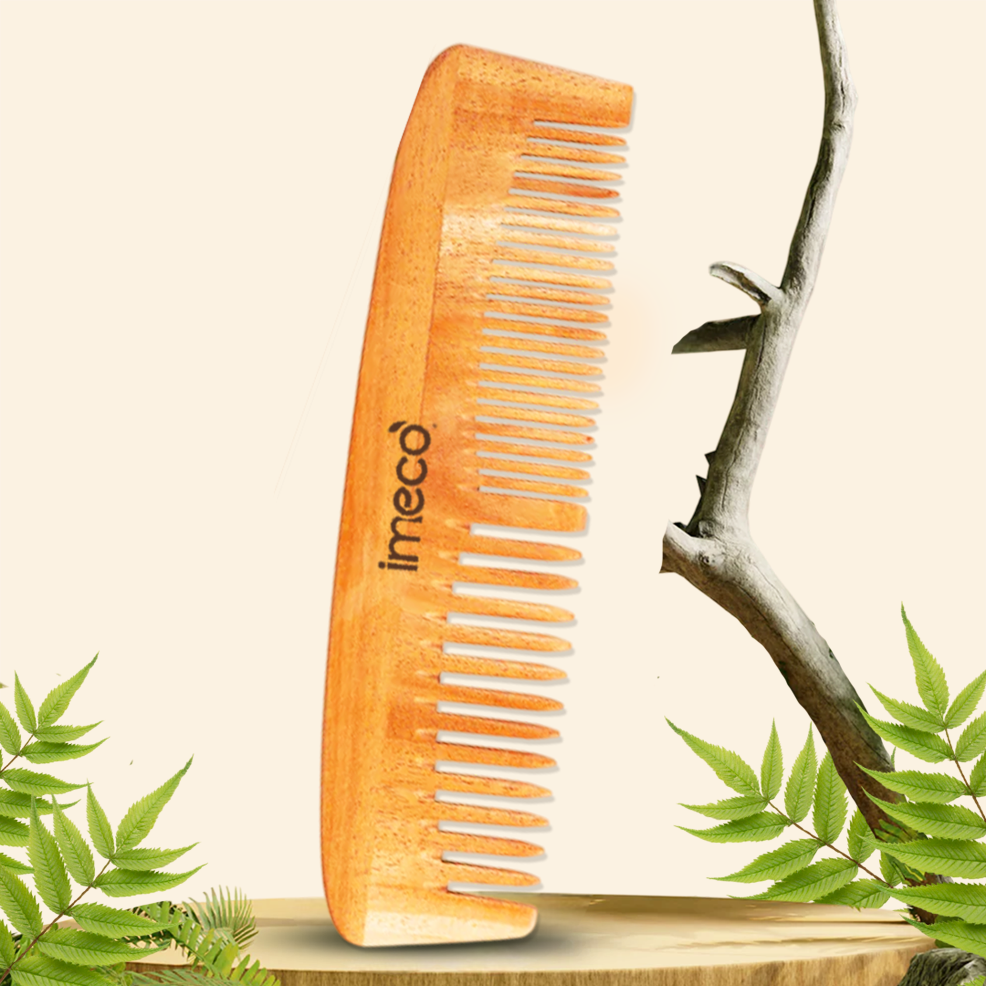 Bamboo dual comb with IMECO branding on a natural background with leaves.